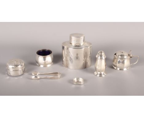 A silver three-piece cruet, a silver tea caddy, a pair of plated sugar tongs, a pill box and a vinaigrette, 5.4oz troy approx