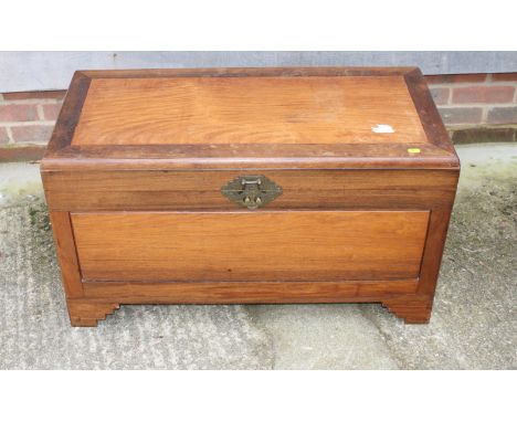A camphor wood blanket box, on shaped bracket supports, 35" wide