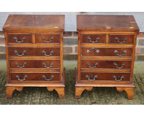 A pair of yew and banded bedside chests of two small and three long drawers, on bracket supports, 16" wide
