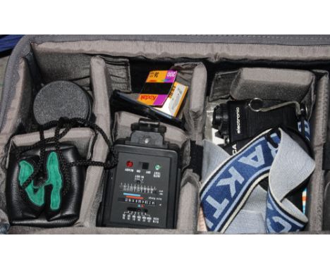 A Panasonic NV-M5 video camera, in carry case, and a collection of assorted cameras and other photographic material
