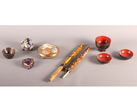 A Japanese Satsuma paste pot, a miniature Japanese tea bowl, three graduated lacquered bowls, two tortoiseshell chopstick hol