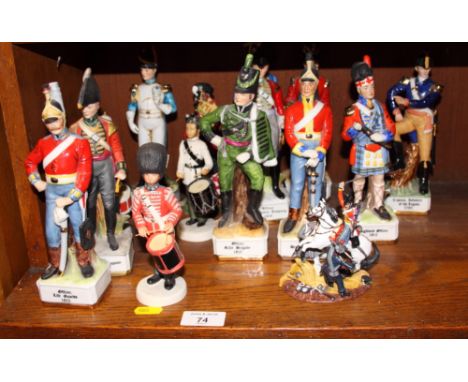 An assortment of modern glazed and bisque ceramic figures of soldiers