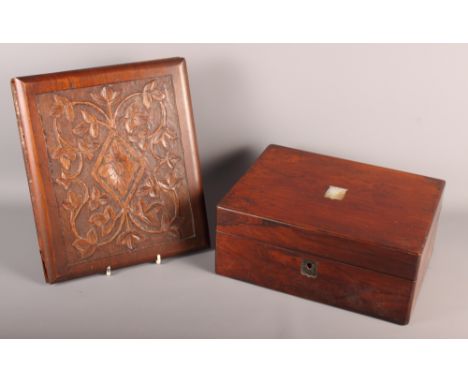 A 19th Century rosewood rectangular workbox, lid inset mother-of-pearl escutcheon, a wooden desk blotter carved leaves and a 