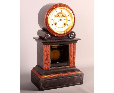 A Tiffany & Co Victorian mantel clock in black slate case with rouge marble insets and visible escapement, 16" high