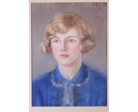 An early 20th Century pastel portrait of a girl in a blue blouse, 16" x 12", in gilt frame, a relief rubbing of a Thai figure