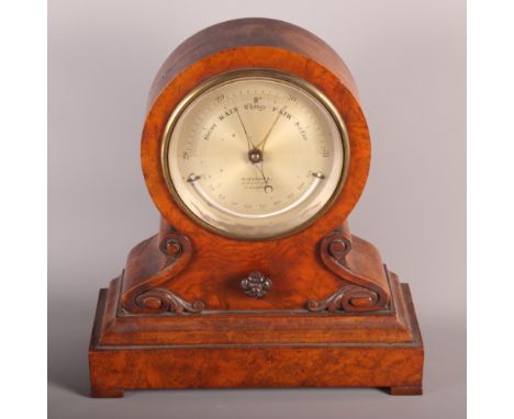 A 19th Century barometer in walnut drum head case, silvered dial with thermometer inscribed "H Hughes Fenchurch Street London