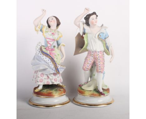 A pair of 19th Century French bisque porcelain dancing figures on circular bases, 9" high, a Royal Worcester blush ivory figu