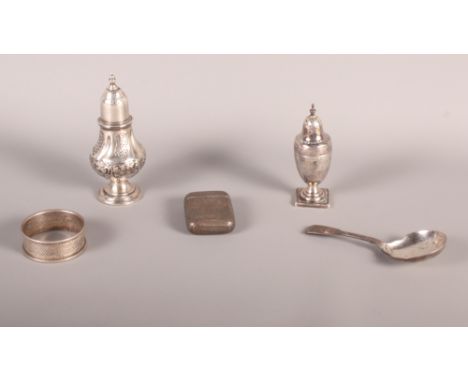 Two silver pepperpots, a silver napkin ring, a silver caddy spoon and a silver vesta case, 4.7oz troy approx