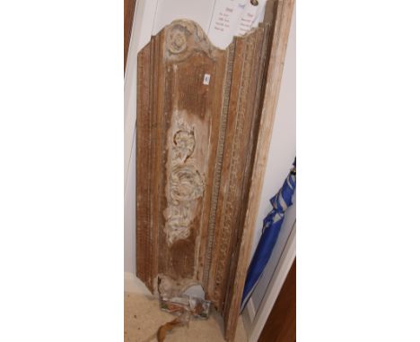 An 18th Century stripped pine fire surround with carved shell and scroll decoration, 65" wide