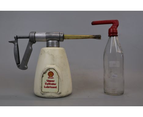 Vintage Shell upper cylinder lubricant can together with Exide battery filling bottle
