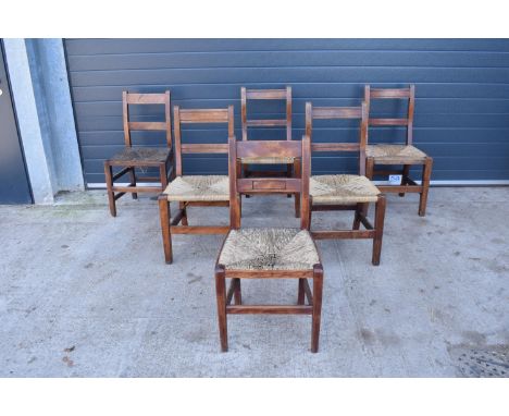 A collection of 6 Victorian ladder back farmhouse chairs with rush seats (All near matching) (6). In used condition but funct