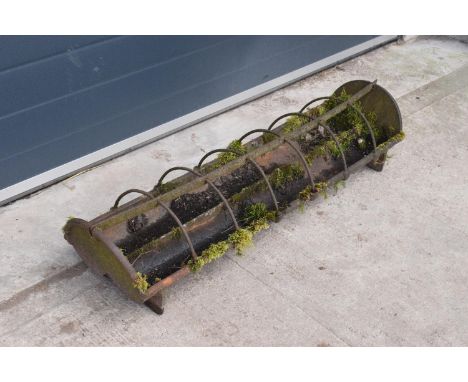 Early 20th century cast iron pig trough which would be ideal as a planter. 