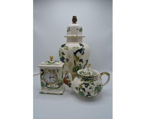 Masons Chartreuse to include a large lamp base, mantle clock and a tea pot (3). Crack to the lamp base and a large chip to th
