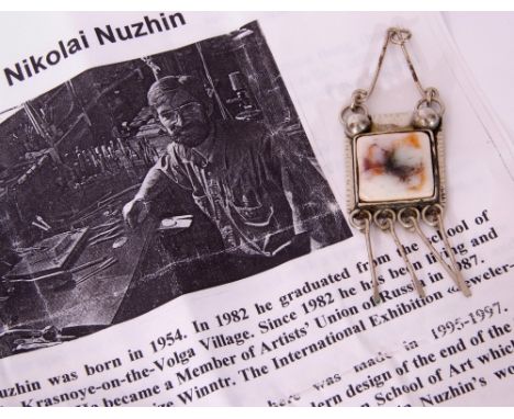 Russian Nikolai Nuzhin designer pendant, the centre with a square coloured ceramic plaque, bezel set in a bead and baton whit