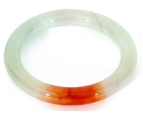 Modern jade bangle, celadon green with brown tones, inside measurement 6cm diam, boxed