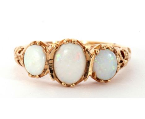 Modern 9ct gold opal ring featuring three graduated oval cabochon opals in an ornate gallery and shoulder setting, size K