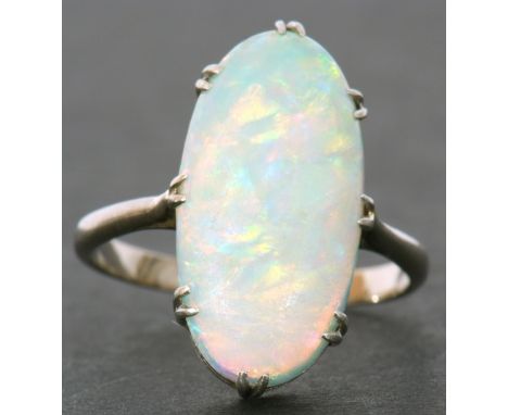 Large opalescent dress ring of oval cabochon shape, 18 x 10mm, prong claw set in a basket mount to a plain white metal shank,