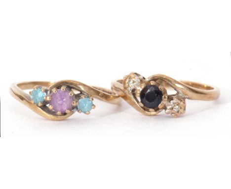 Mixed Lot: 9ct gold, dark sapphire and small diamond cross-over ring, size L/M, together with a 9ct gold amethyst and topaz c