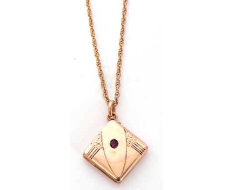 Yellow metal Art Deco square locket, engraved with shoulder details, highlighted with a small ruby (unmarked), suspended from