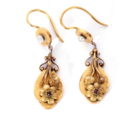 Pair of Victorian high carat gold drop earrings, the oval shaped drops applied with a chased and engraved flower and leaf des