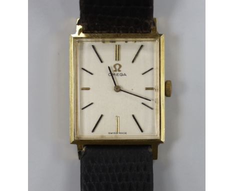 A gentleman's 18k Omega manual wind rectangular dress wrist watch, on associated leather strap, case diameter 24mm, no box or