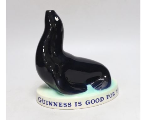 A Carltonware Guinness ‘seal’ lamp stem “Guinness is good for you”, 18cm tall