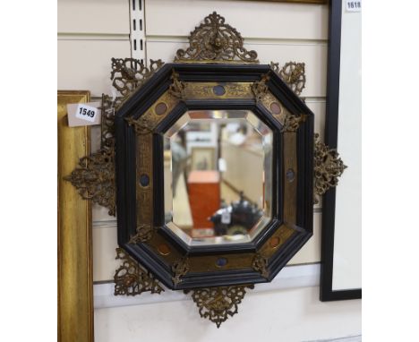 A 19th century Italian gilt bronze and hardstone-mounted ebony octagonal mirror, 52 x 48cm