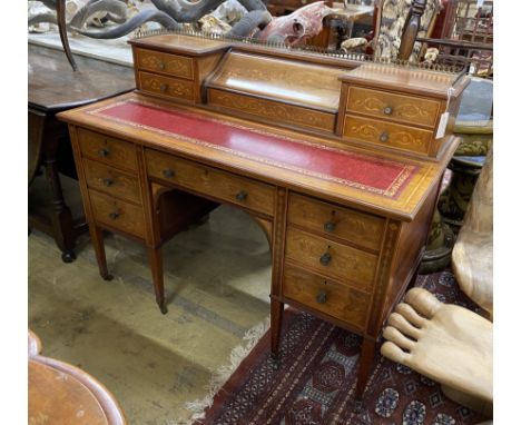 An Edwardian Edwards &amp; Roberts Sheraton Revival satinwood banded marquetry inlaid mahogany kneehole writing desk, width 1