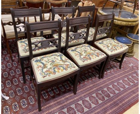 A set of six George IV mahogany dining chairs with tapestry drop in seats, height 85cm