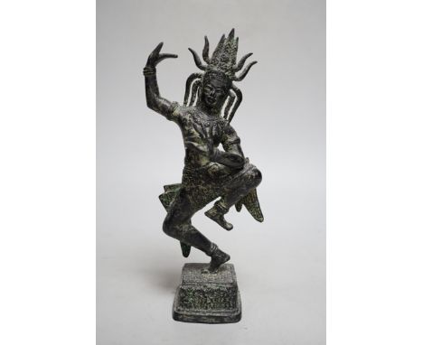 A Khmer style bronze figure of a deity, 24cm high
