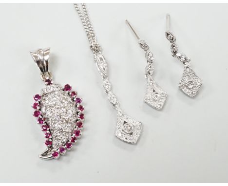 A modern white metal ruby and diamond cluster set drop pendant, modelled as a pear, overall 26mm, together with a modern 375 