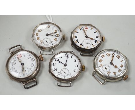 Five assorted early to mid 20th century manual wind wrist watches, including four silver.