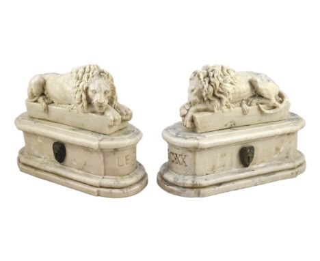 After the Antique. A pair of marble resin models of the Medici lions, each seated upon an oblong plinth, applied with bronze 