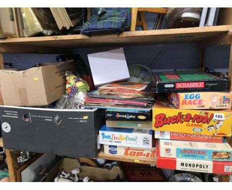 A shelf of assorted vintage board games etc.