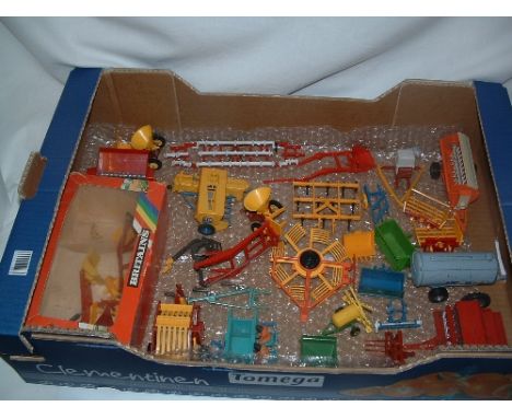 Over 25 x BRITAINS Tractor attachments and items of Farm equipment. Mostly Good with Set 9574 in a Box missing internal Keeps