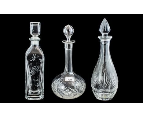 Three Decorative Glass Decanters, one in square form 13" tall with etched decoration, one bowl shaped decanter 12" tall, and 