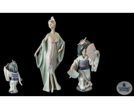 Lladro Hand Painted Pair of Porcelain Figures. Comprises 1/ Sophisticate, Model 5787. Issued 1991 - 1998. Height 10.5 Inches.
