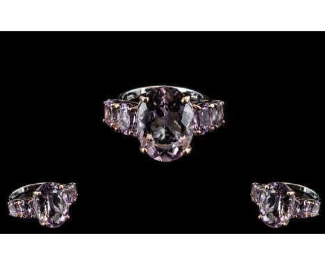 Rose De France Amethyst Statement Ring, a large oval cut of 8.5cts of sparkling Rose de France amethyst, flanked by two gradu