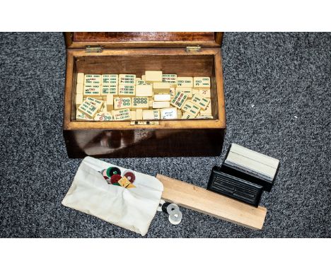 A 19th Century Tea Caddy, containing a Mah Jong set, cards, dice and counters. 