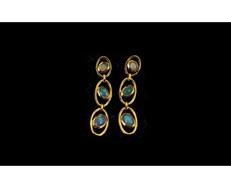 Opal Pair of Triple Drop Earrings, each earring having three graduated, oval cut, opal cabochons, with a good variety of natu