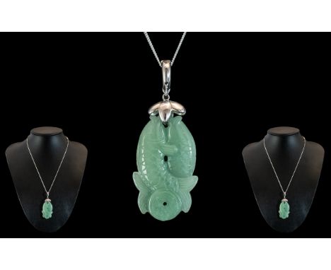 Chinese Jade Pendant in the Form of Two Fish, attached to a 925 silver chain, marked for silver.  Size of pendant 2" - 5 cm. 
