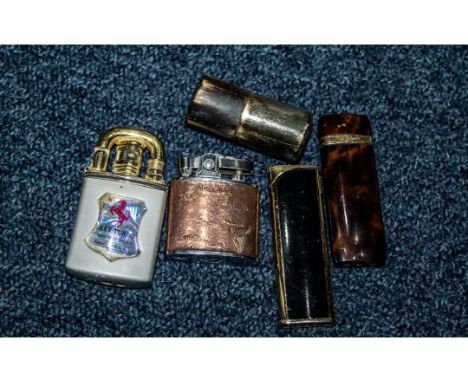 Collection of Five Cigarette Lighters, assorted styles.  Including Yves Saint Laurent, and a trench lighter, and Modernlite.