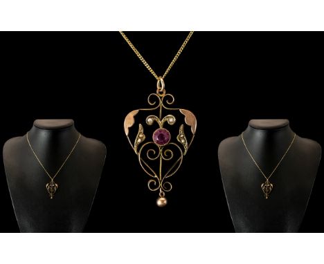 9ct Gold Art Nouveau Pendant Set With A Central Amethyst And Split Seed Pearls, Suspended on A Fine 9ct Gold Chain.