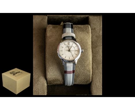 Ladies Burberry Watch. The Watch has the Classic Leather Design Strap, The Length Is Approx 9 Inches long. Comes with Full Pa