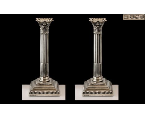 A Fine Pair of Sterling Silver Classical Corinthian Column - Square Based Candlesticks of Pleasing Proportions / Form. Hallma