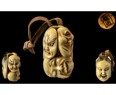 Japanese 19th Century Superbly Carved Double Sided Mask Netsuke. The Reverse Side with Three Non Face Masks, Signed to Interi