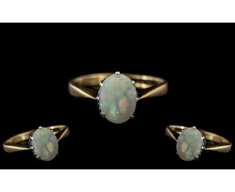 9ct Gold Ladies Dress Ring With Central Oval Opal Measuring 8x6mm, Fully Hallmarked, Gross Weight 1.8g Ring Size I