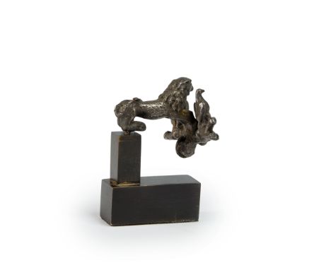 A Roman silver fibula with a lion, mounted with hares and birds, 2nd-3rd Century A.D.The lion depicted crouching, with spotte
