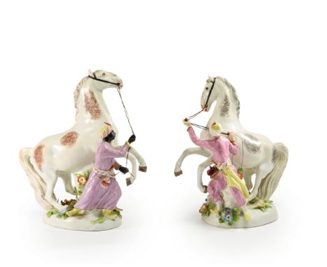 Two porcelain figures of horses and their Turk grooms,  Samson, France, late 19th/early20th century, Each horse prancing in a