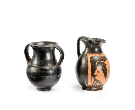 A small Etruscan Bucchero Ware amphora, incised banding on the lower body, circa 7th Century B.C., 9.1cm high, an old label o
